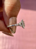 Woman wearing the white gold marquise diamond promise ring on her hand