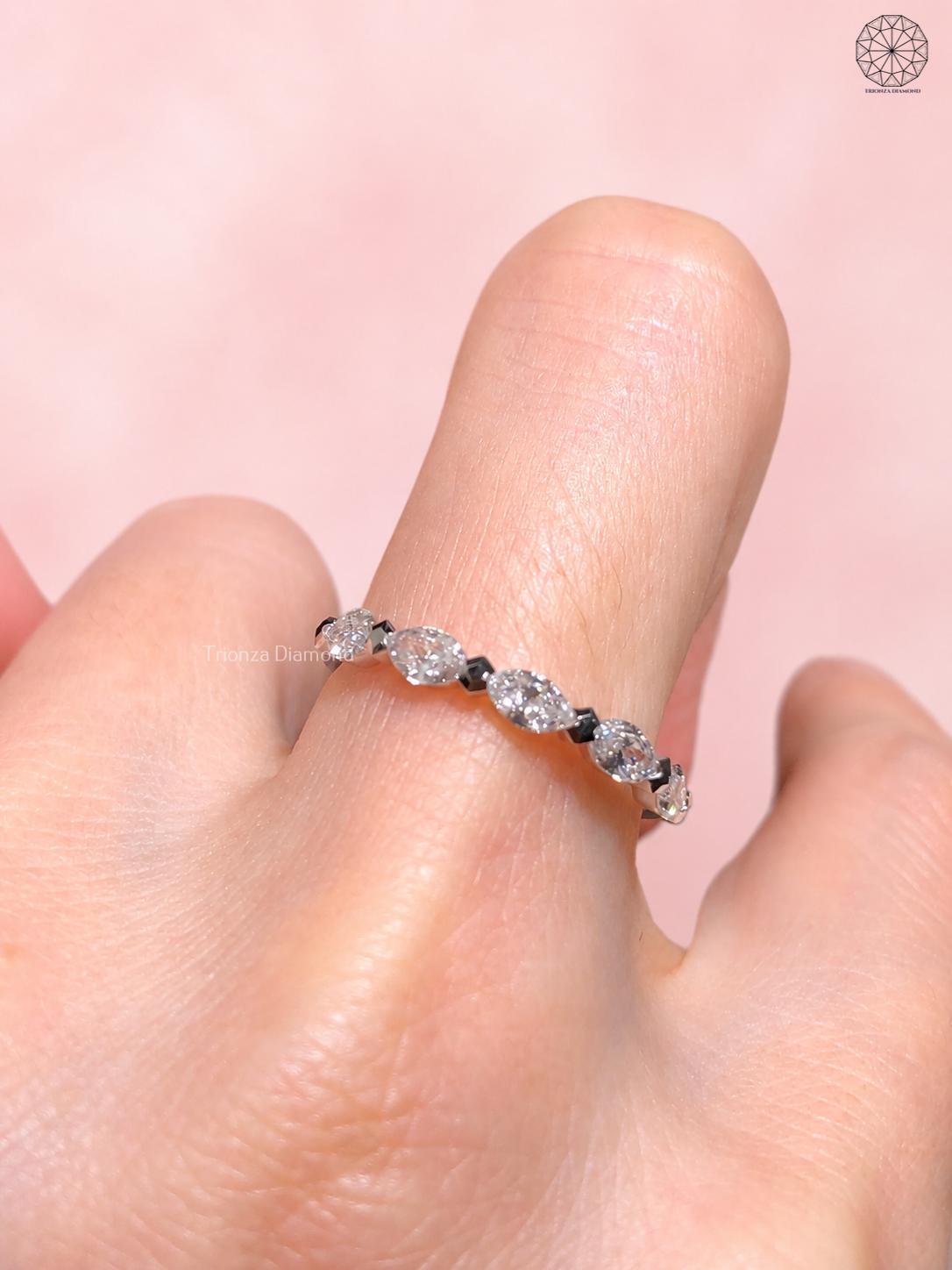 Handmade 14k gold wedding band featuring 0.51 TCW marquise lab grown diamonds
