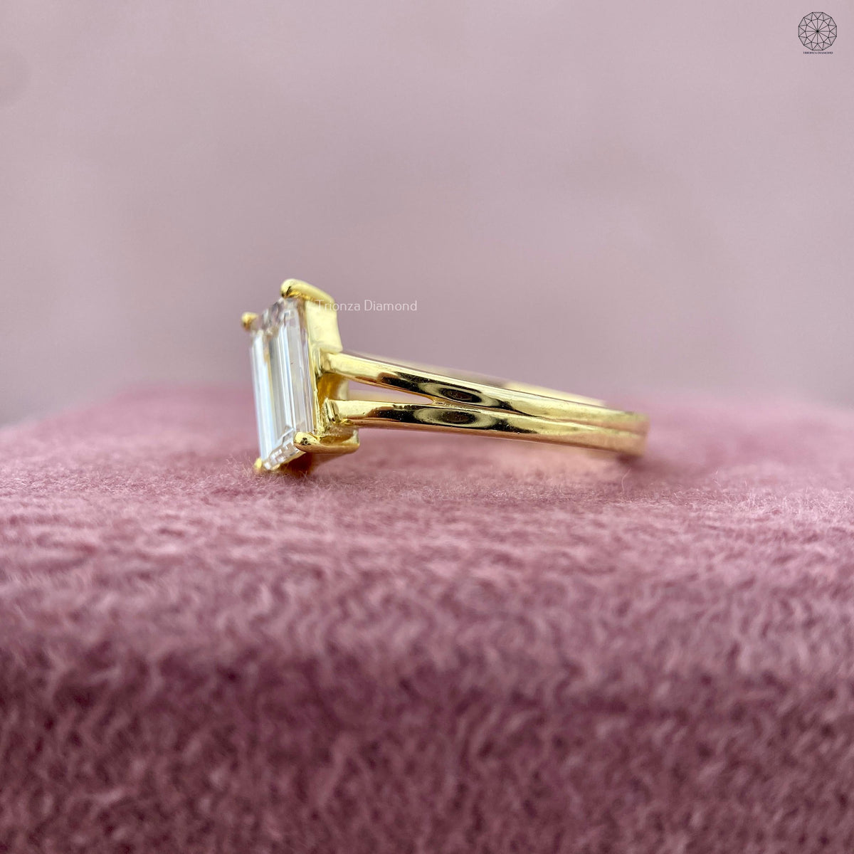 Double band engagement ring crafted with an emerald cut lab grown diamond centerpiece