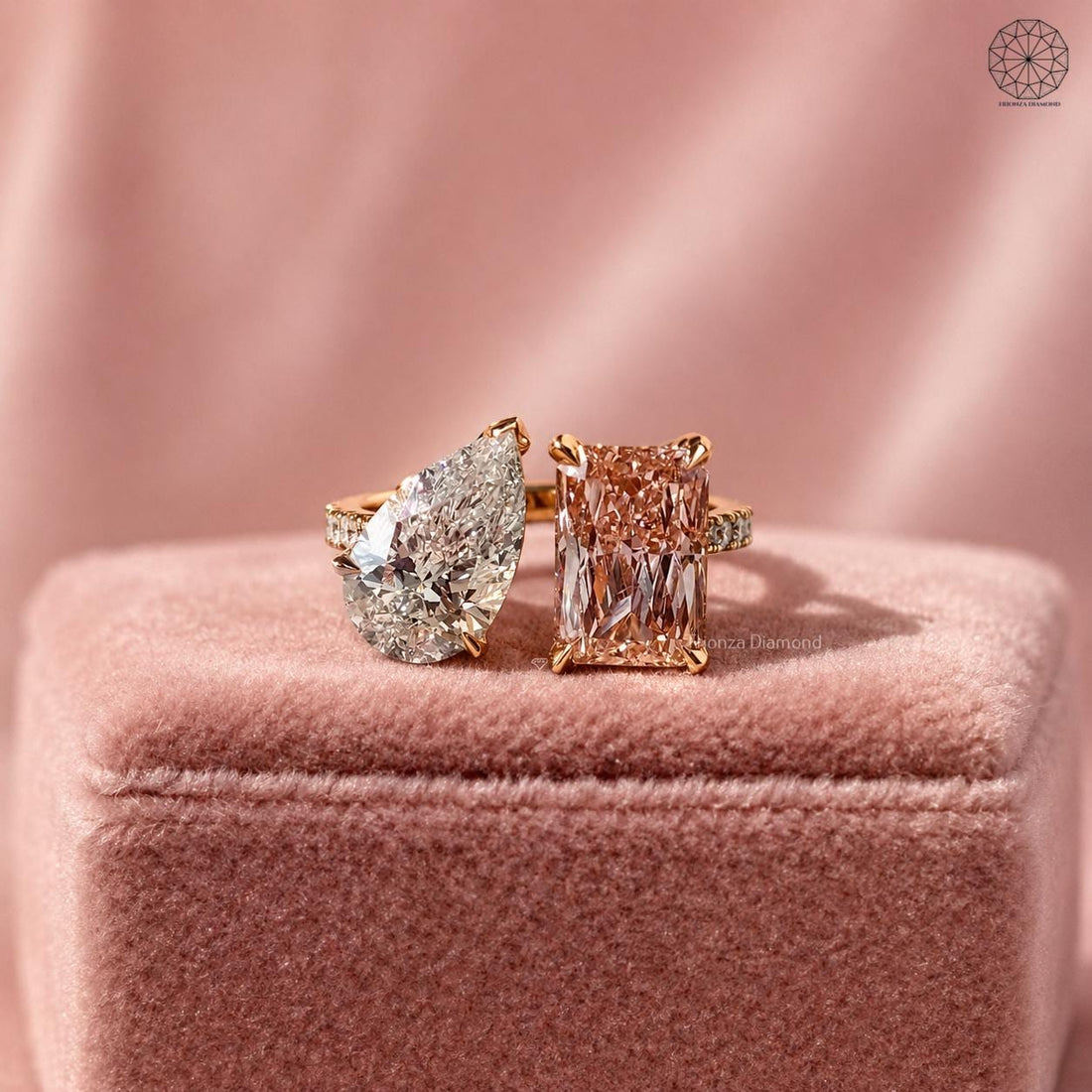 Pink radiant cut lab diamond toi et moi ring paired with a pear cut side stone in 14K gold