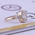 Close-up of the bezel set cushion diamond showing E color and VVS2 clarity detail