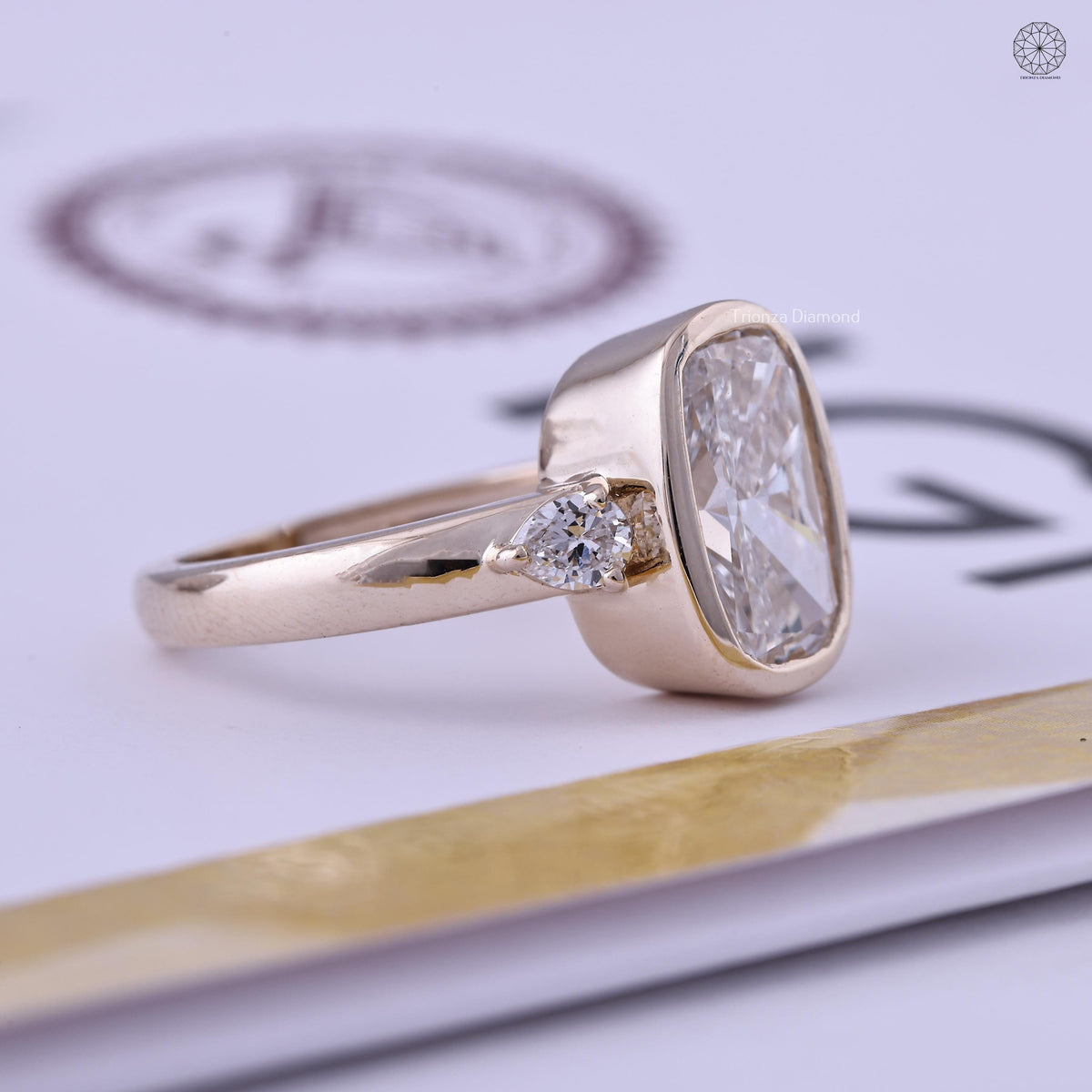 Close-up of the bezel set cushion diamond showing E color and VVS2 clarity detail