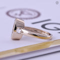 Woman wearing the cushion cut diamond ring, close-up view on her hand