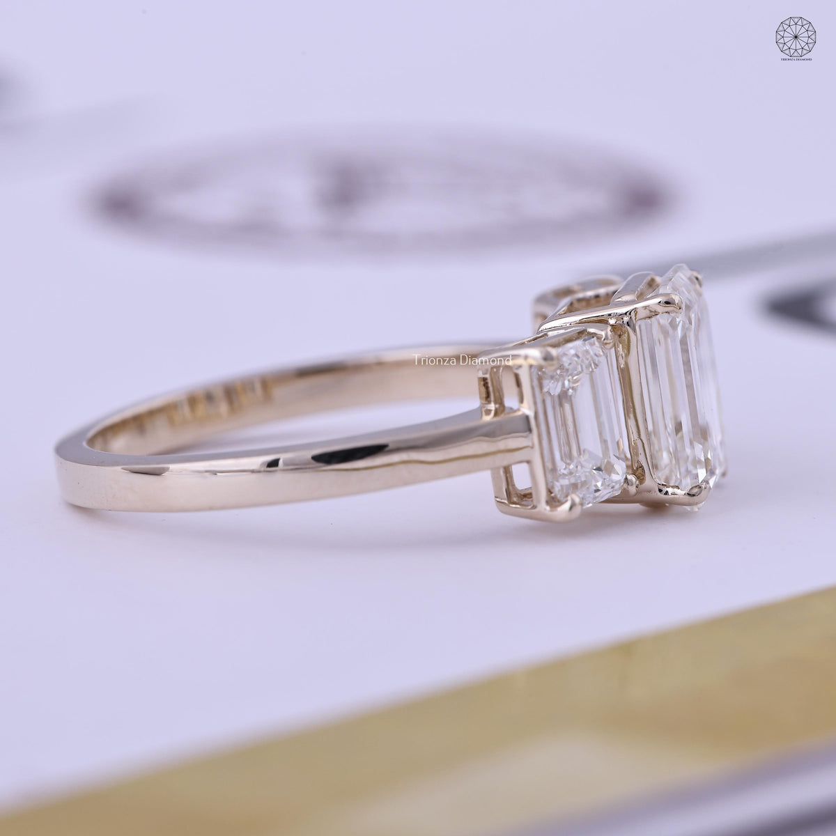 Emerald cut bridal ring presented in its jewelry box with smooth fabric lining