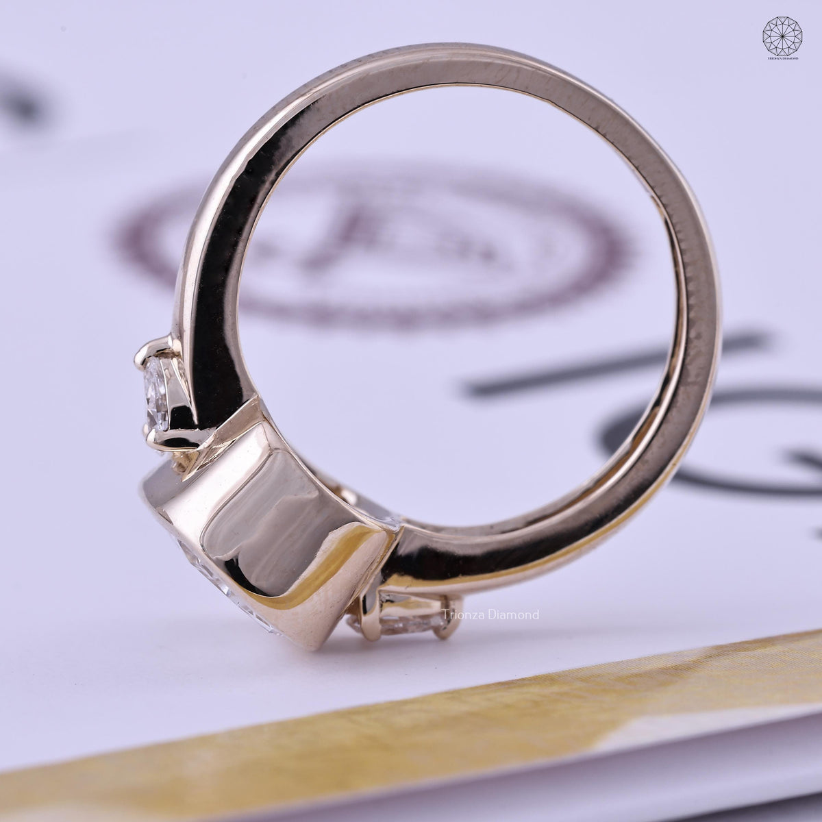 IGI certified lab grown cushion diamond set in a handmade TrionzaDiamond three stone ring