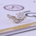 Oval lab grown diamond engagement ring with a curved gold band and cluster diamond accents
