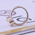 Top view of the oval diamond solitaire ring showing its F color and VS1 clarity
