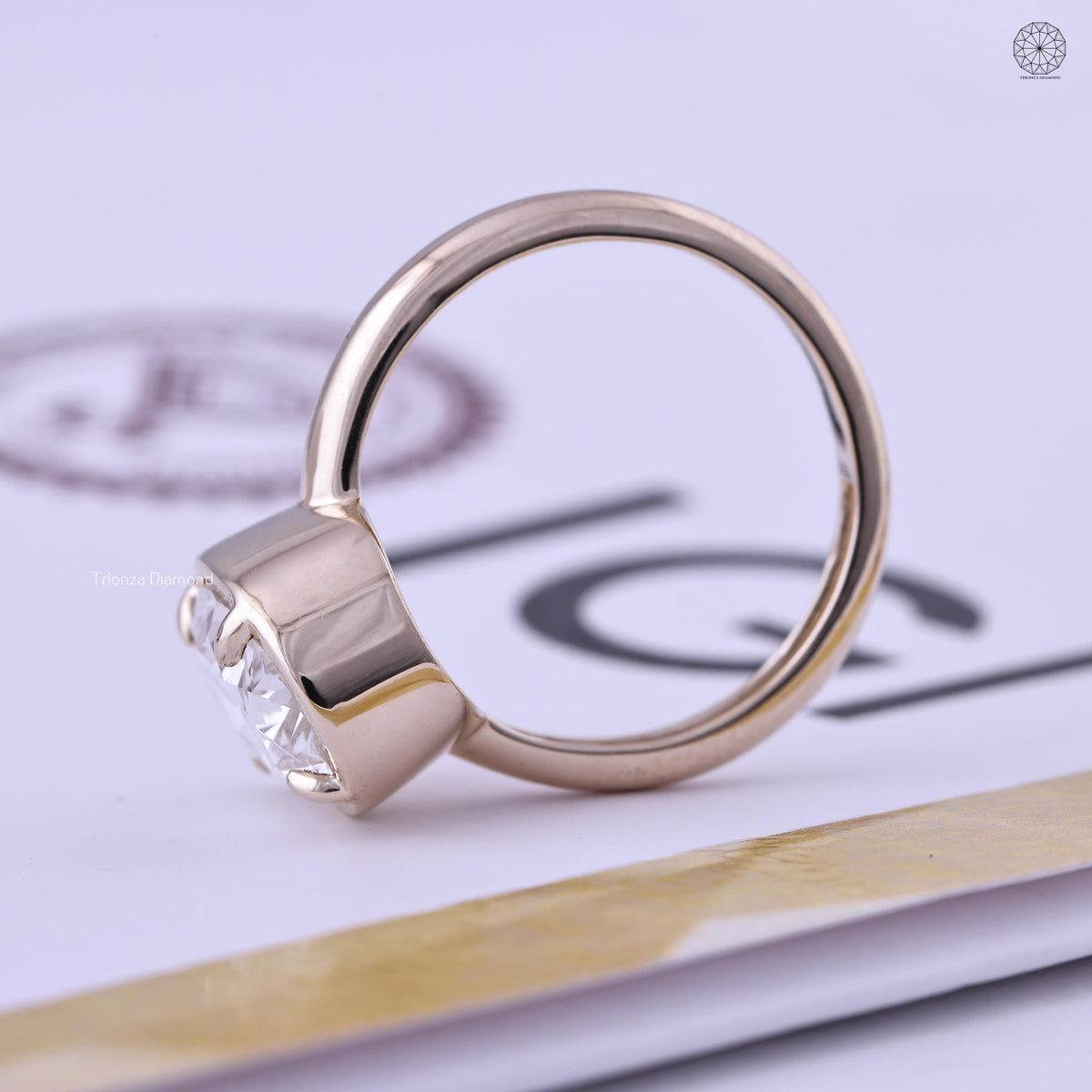 Top view of the oval diamond solitaire ring showing its F color and VS1 clarity