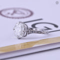 Art deco engagement ring featuring a hand crafted floral engraved band design