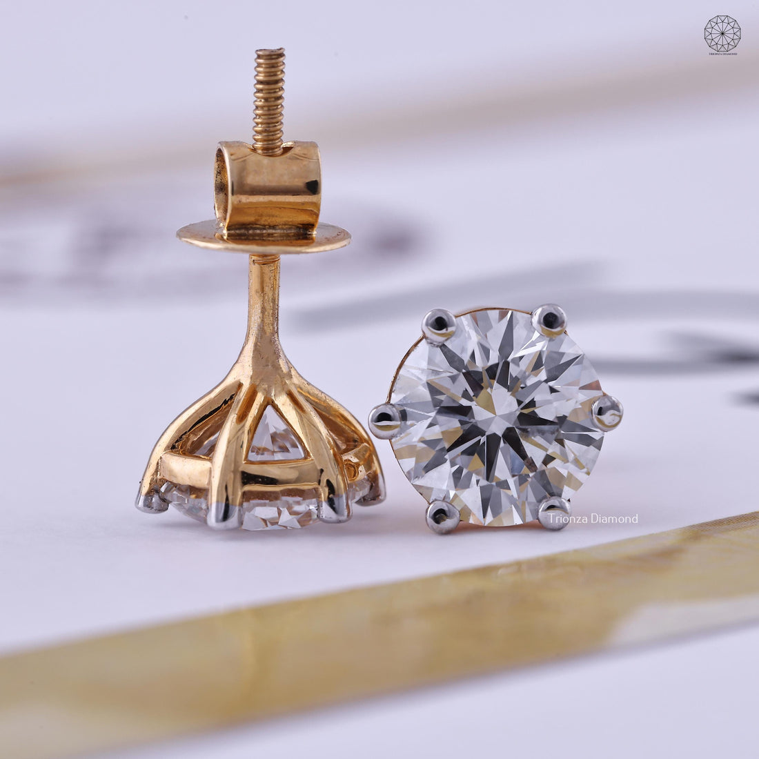 Round cut lab grown diamond stud earrings in 14K solid yellow gold with a solitaire setting