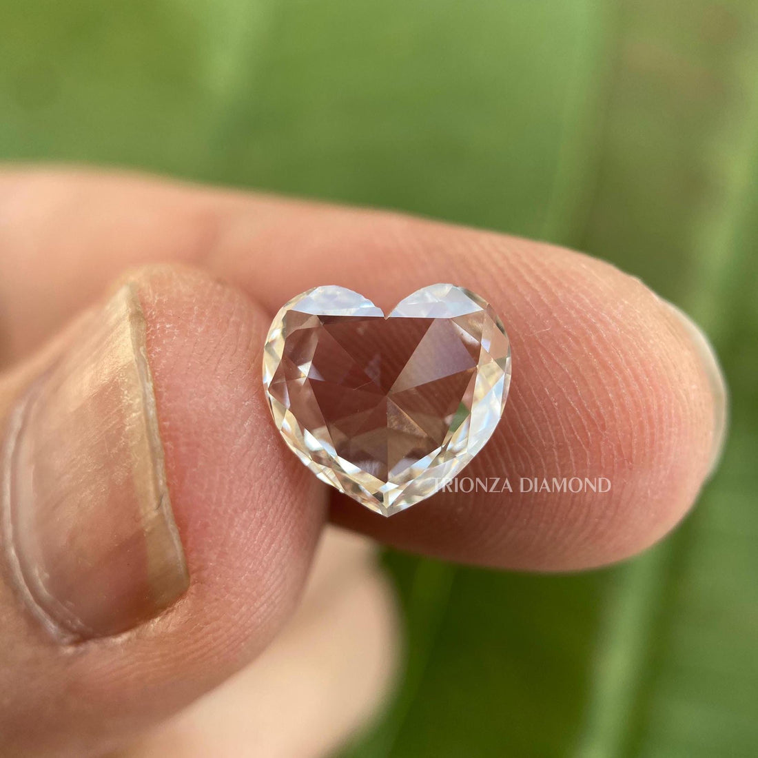 Heart rose cut lab grown diamond displayed to showcase its colorless vintage cut brilliance